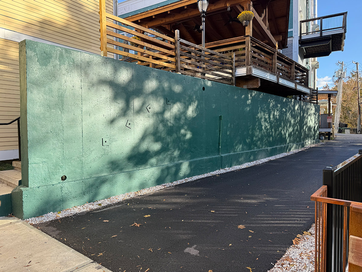 The green wall by the Riverwalk in Manchester, VT, that needs artwork!