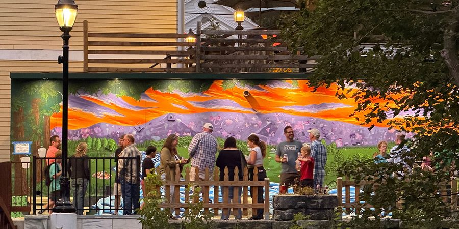 The Riverwalk Mural in progress September 2026